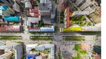 Aerial city view with crossroads and roads, houses, buildings, parks and parking lots, bridges. Copter shot. Panoramic image.