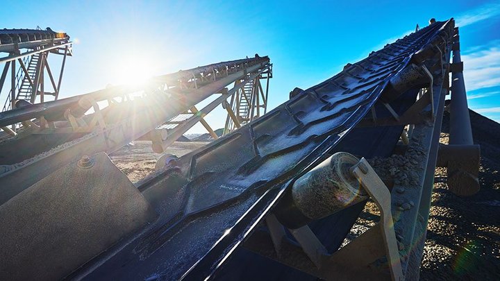 Industrial background with gravel crusher. Conveyor belts for th