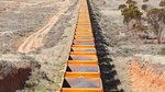 Train carrying iron ore trees mining