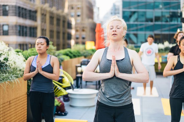 WeWork's rooftop yoga experience.