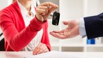 Woman hands over car keys