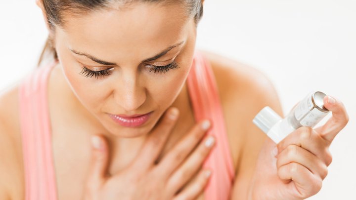 Woman having asthma attack