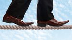 bigstock-Businessman-on-a-tightrope-con-49063478