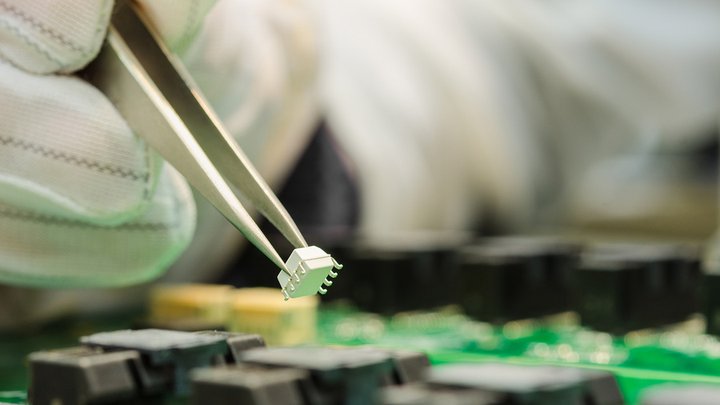 bigstock-Female-Hand-In-Esd-Gloves-Hold-62566532