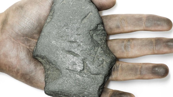 hand graphite rubbed off mineral rock