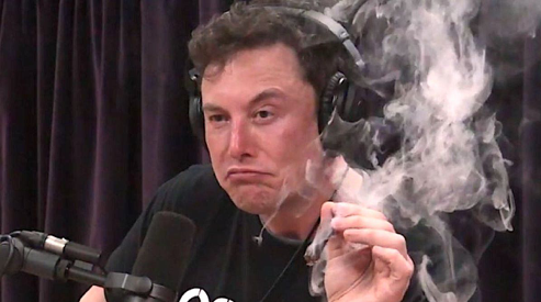Elon Musk takes a drag